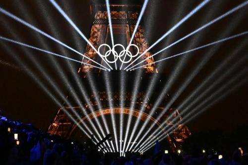 Lights illuminate the Eiffel Tower during the opening ceremony of the Olympic Games in Paris,