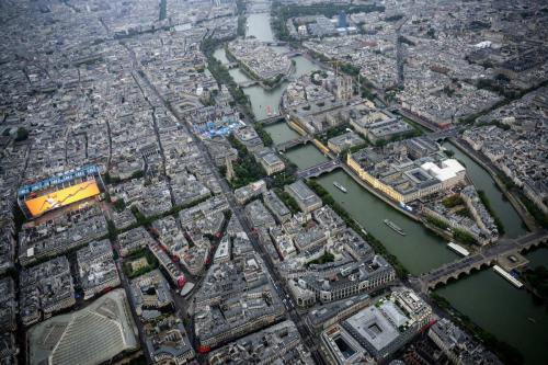An aerial view of Notre-Dame de Paris Cathedral as delegations boats navigates on the Seine past the Ile de la Cite Island (front R), Saint-Louis Island (rear R) and Centre Pompidou museum (L) during the opening ceremony of the Paris 2024 Olympic